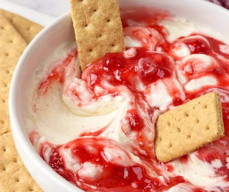 Delicious easy strawberry cheesecake dip served with fresh strawberries and graham crackers