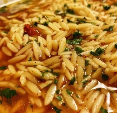 Bowl of Greek Manestra showcasing its rich flavor and ingredients