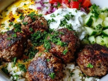Delicious Greek meatball bowl with veggies and sauce