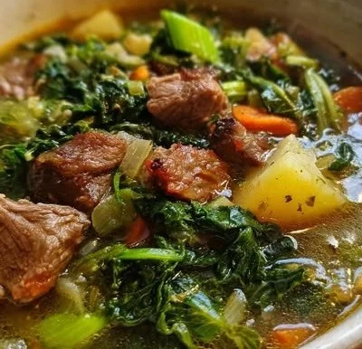 Bowl of hearty keto soup, a comforting low-carb meal for cold days.