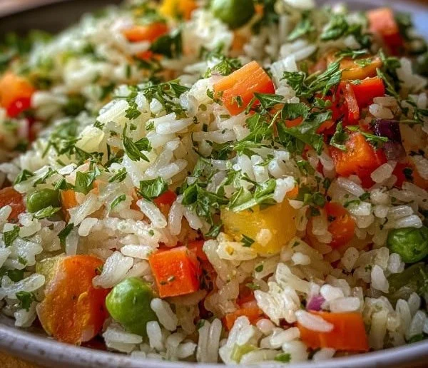 Bowl of herbed vegetable rice with vibrant vegetables and herbs