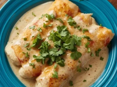 High protein white sauce chicken enchiladas in a creamy white sauce