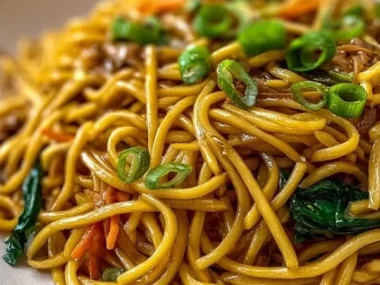 Homemade Lo Mein noodles ready to be served with fresh vegetables