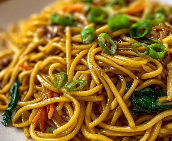 Homemade Lo Mein noodles ready to be served with fresh vegetables