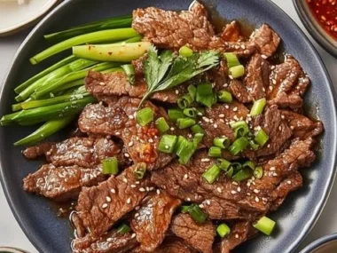 Delicious Korean beef bulgogi marinated and cooked, garnished with vegetables