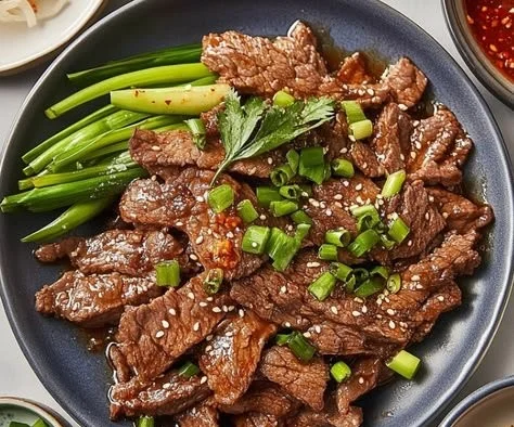 Delicious Korean beef bulgogi marinated and cooked, garnished with vegetables