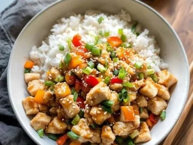 Delicious Kung Pao Chicken Bowls with colorful vegetables and peanuts