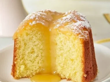 Delicious slice of limoncello cake with lemon zest and frosting