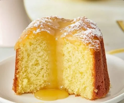 Delicious slice of limoncello cake with lemon zest and frosting