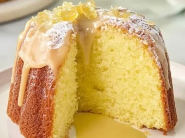 Limoncello Cake with lemon drizzle and frosting on a white plate