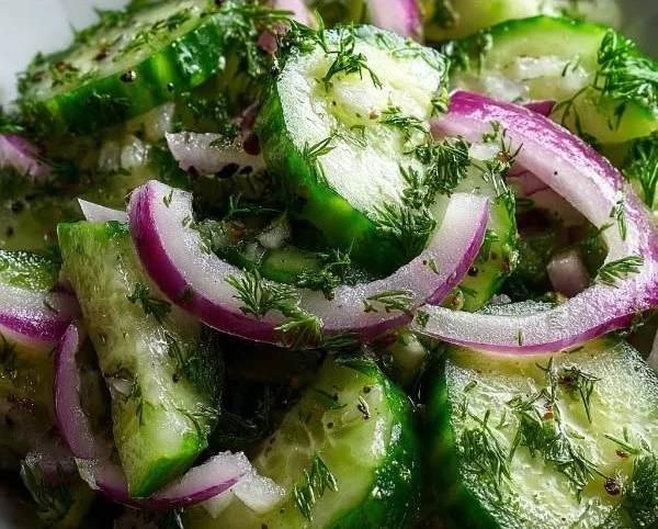 Low-calorie crunchy cucumber salad with fresh ingredients