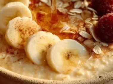 Delicious oatmeal custard breakfast served in a bowl topped with fruits