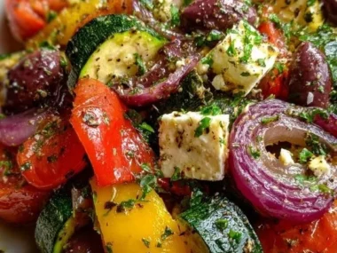 Colorful one pan Greek vegetables dish with fresh ingredients