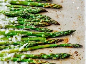 Roasted Parmesan Asparagus garnished and served on a plate