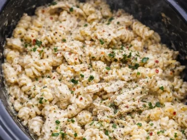 Delicious Parmesan Garlic Chicken Pasta served in a bowl with fresh herbs