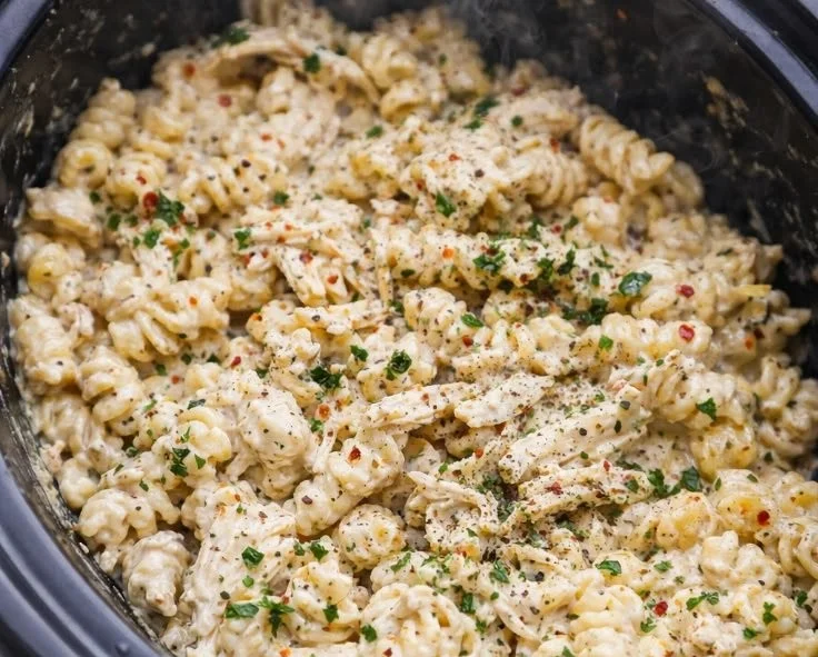 Delicious Parmesan Garlic Chicken Pasta served in a bowl with fresh herbs