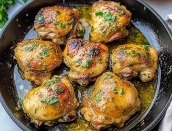 Perfectly baked boneless skinless chicken thighs on a plate