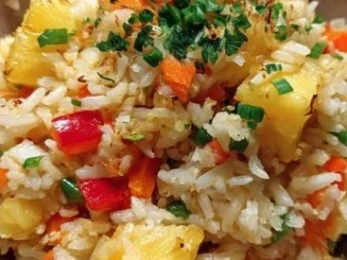 Deliciously prepared Pineapple Rice topped with vibrant vegetables and herbs