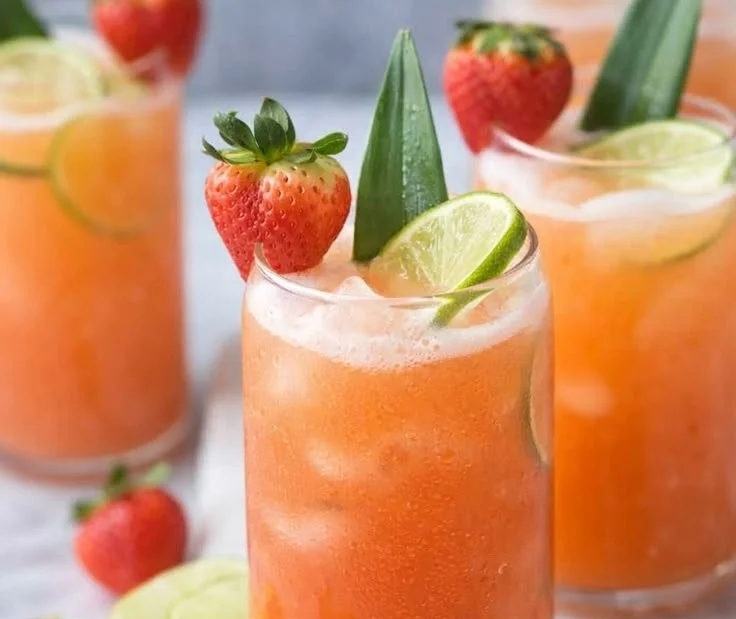 Pineapple Strawberry Water in a glass with fresh fruits