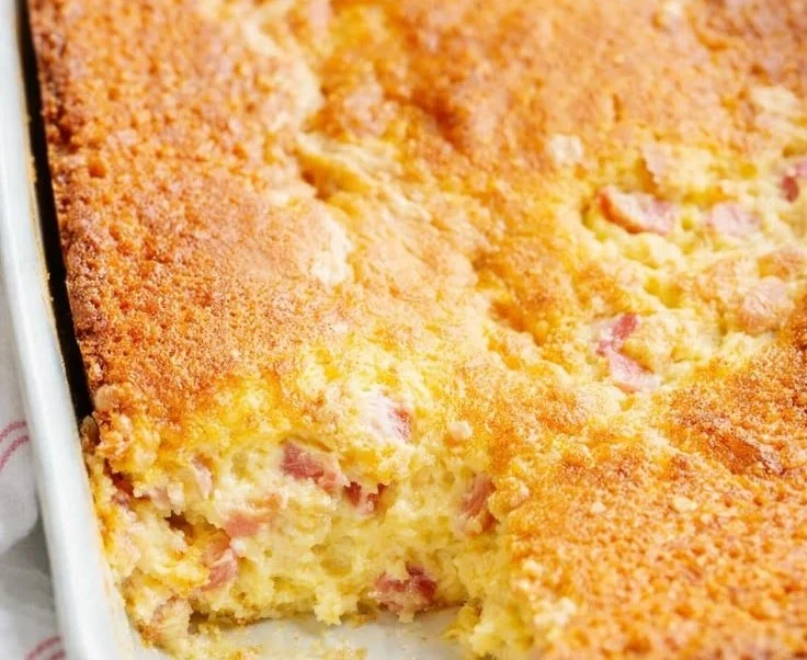 Delicious slice of Rhubarb Custard Cake with a golden crust and creamy filling.