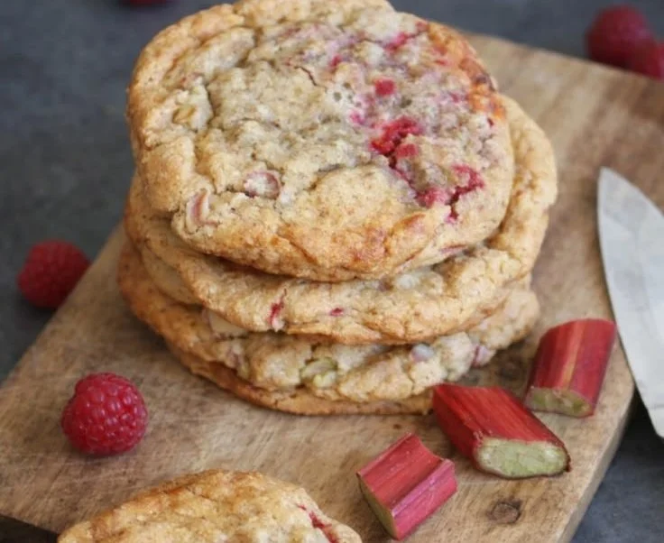Homemade rhubarb raspberry cookies on a baking tray ready to serve.