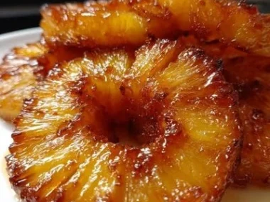 Delicious rum-soaked fried pineapple served as a tropical dessert treat