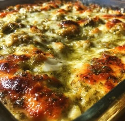 Delicious salsa verde chicken casserole topped with cheese and fresh cilantro