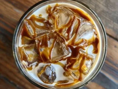 A delicious Salted Caramel White Russian cocktail with caramel drizzle