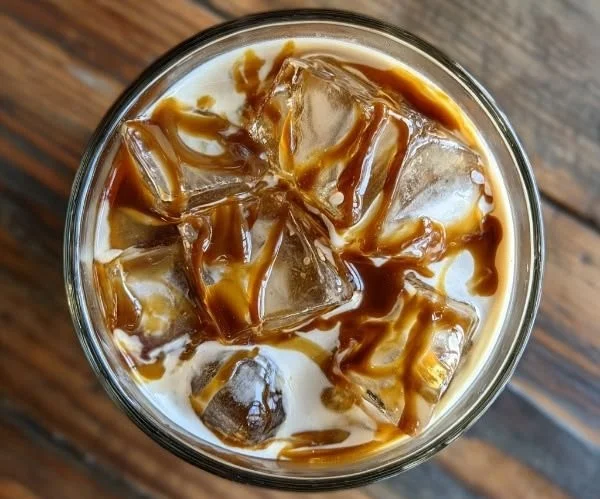 A delicious Salted Caramel White Russian cocktail with caramel drizzle