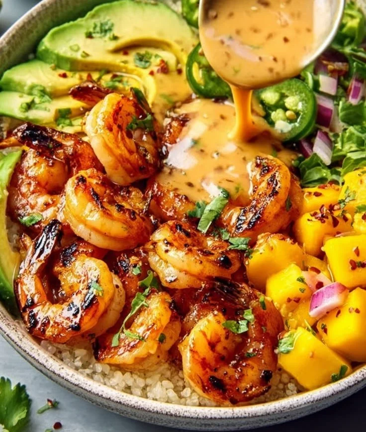 Shrimp avocado bowls with mango salsa and lime-chili sauce.
