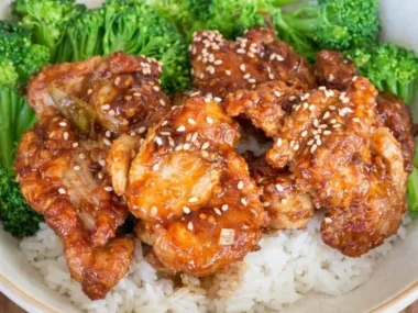Delicious Soy Garlic Chicken served with garnishes and rice