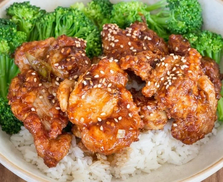 Delicious Soy Garlic Chicken served with garnishes and rice