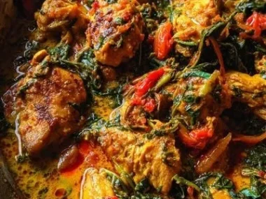 Delicious Spicy Brazilian Coconut Chicken served with fresh herbs.