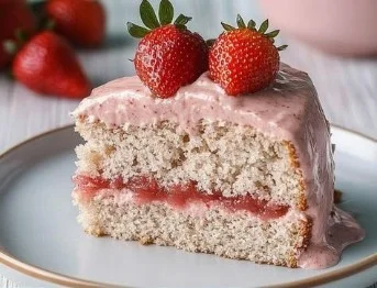 Delicious homemade Strawberry Cake topped with fresh strawberries and whipped cream