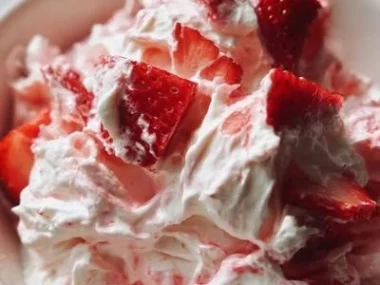 Delicious Strawberry Shortcake Fluff Salad garnished with fresh strawberries