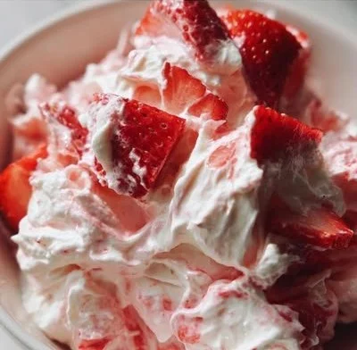 Delicious Strawberry Shortcake Fluff Salad garnished with fresh strawberries