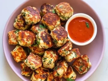 Delicious Veggie Ricotta Fritters served with a side of dipping sauce