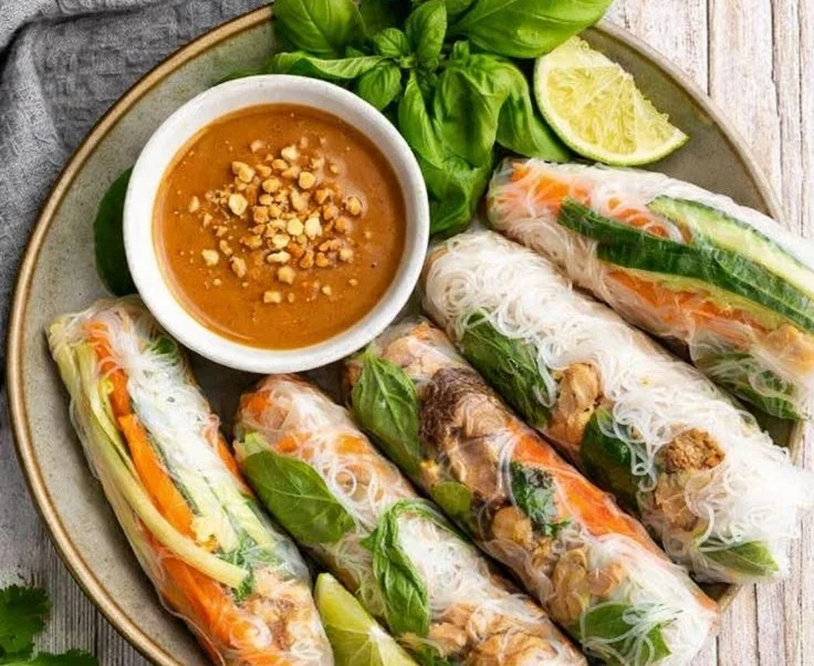 Fresh Vietnamese summer rolls with colorful vegetables and herbs